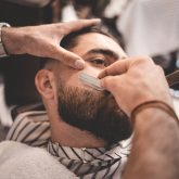 barber-shaves-the-beard-of-the-client_Easy-Resize.com