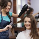 female-hairdresser-using-hairbrush-and-hair-dryer_Easy-Resize.com