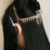 the-hairdresser-does-hair-extensions-to-a-young-girl-in-a-beauty-salon_Easy-Resize.com